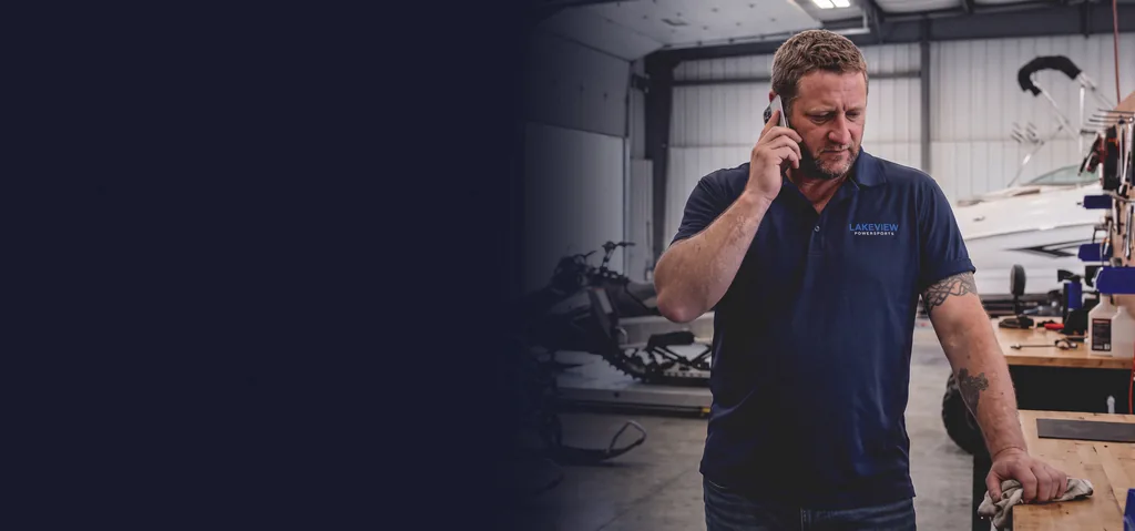 A Lakeview mechanic answering the emergency line in the workshop