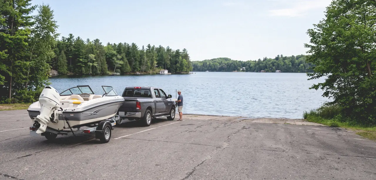 A pickup and boat trailer waiting at a Haliburton launch ramp