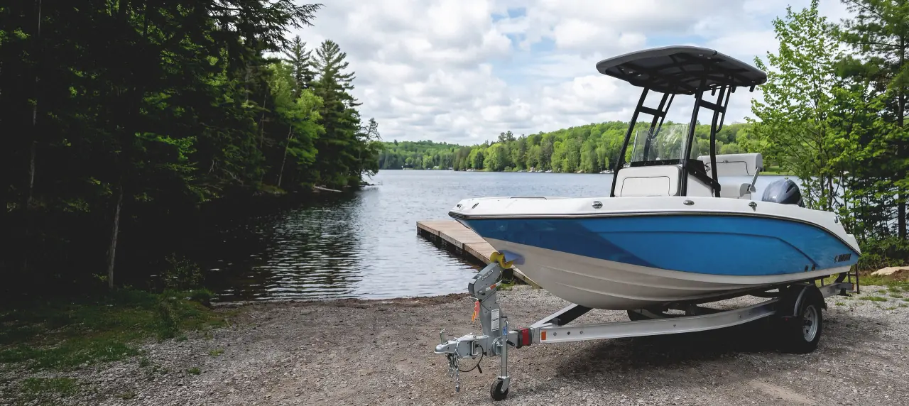 A boat on its trailer at a Haliburton launch ramp on a summer morning